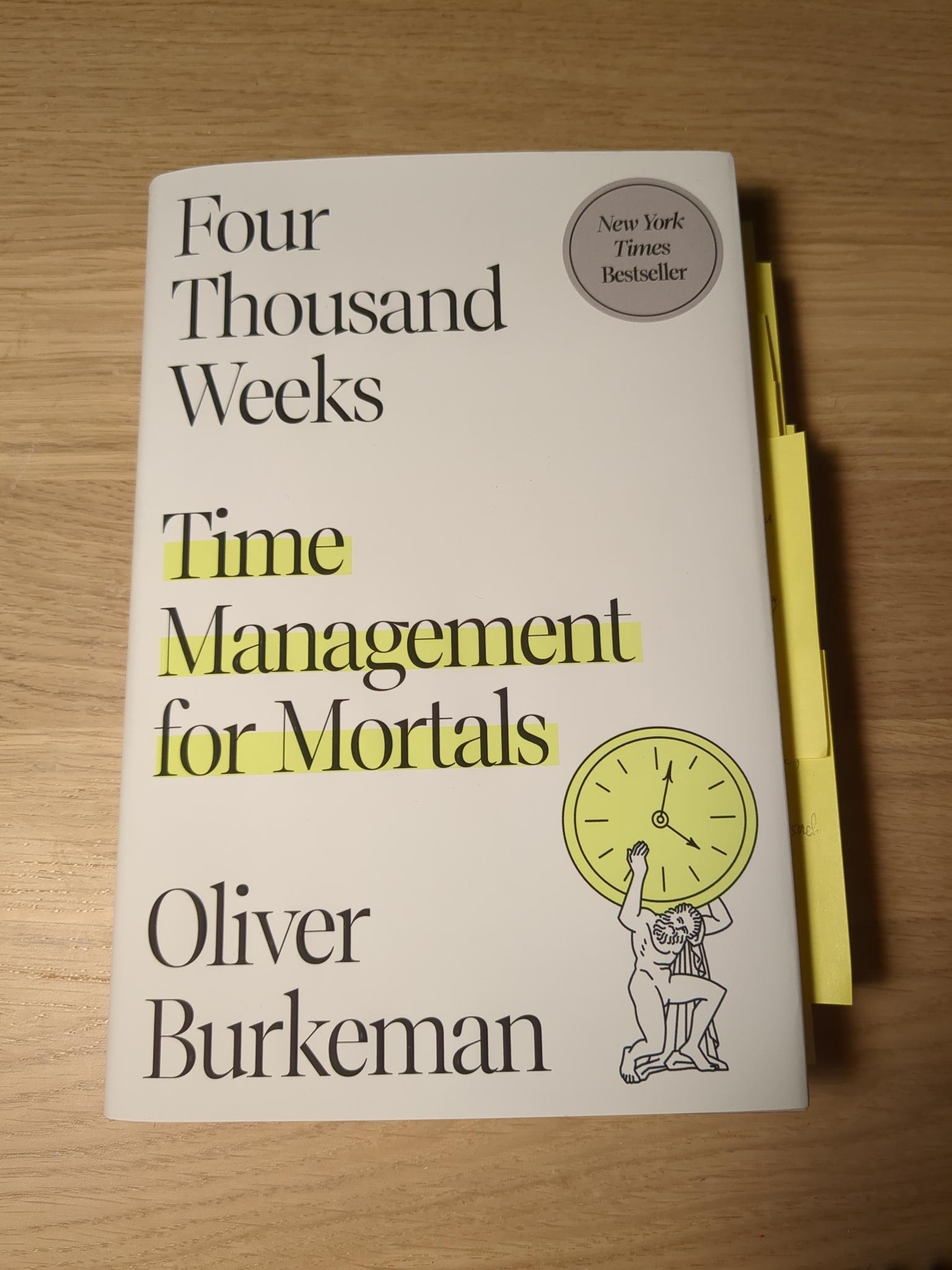 Four Thousand Weeks book in softcover form on top of a desk